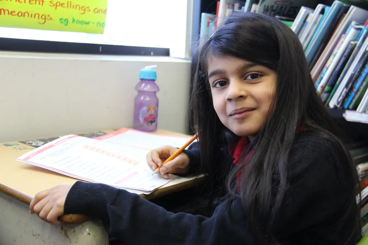 A Hope Academy Student smiling at the camera
